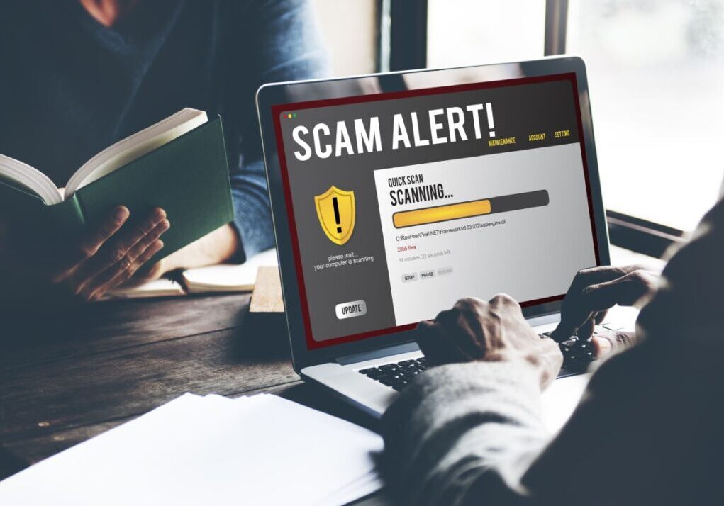 A scam alert on a laptop